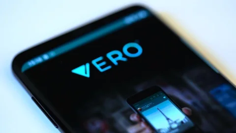 Finger tapping the Vero icon to open the application on a smartphone. Stock Footage 108563813