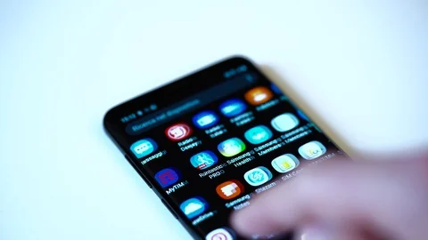 Finger tapping the Vero icon to open the application on a smartphone. Stock Footage 108564107