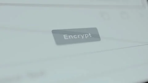 Finger taps the button labeled Encrypt, converting data into a secret code Stock Footage 329750669