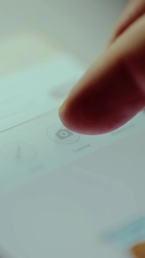 Finger taps the Camera icon on mobile phone screen Stock Footage 326947212