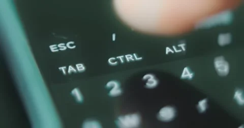 Finger taps the CTRL button on digital keyboard Stock Footage 313621917