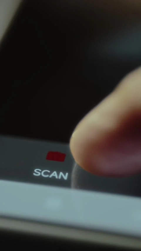 Finger taps a digital button labeled SCAN Stock Footage 327899945