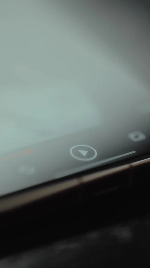Finger taps the PAUSE and PLAY buttons for a video on the mobile phone screen Stock Footage 327523859