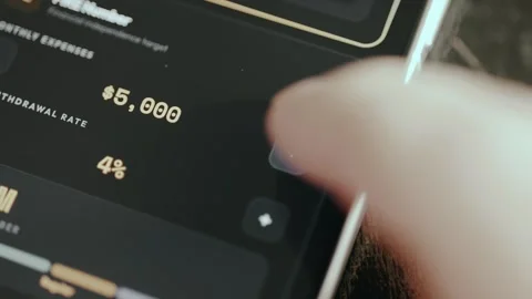 Finger taps the Plus button to change the amount for Monthly Expenses Stockbeeldmateriaal 332484088