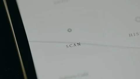 Finger taps the SCAN button within a user interface Stock Footage 331577094