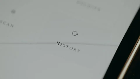 Finger taps the user interface button labeled History Stock Footage 331577107