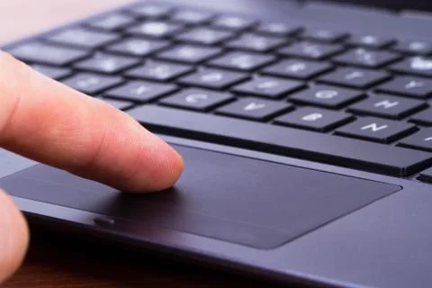 Finger on touch pad Stock Photos
