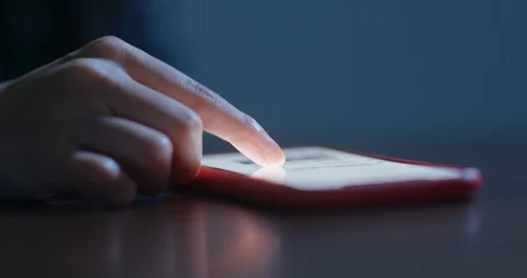 Finger touch on the screen of cellphone at night Stock Footage 106969601