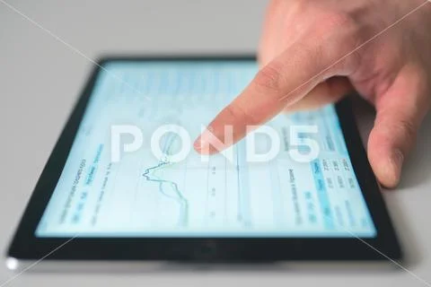 The finger touch the tablet screen Stock Photos