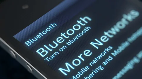 Finger touches down the Bluetooth icon Video stock 78611798