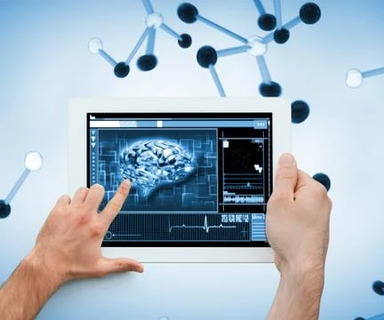 Finger touching a brain on a tablet Stock Photos