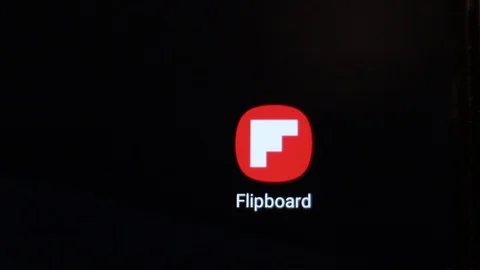 Finger touching the Flipboard icon to open the application on a smartphone Video stock 126843273