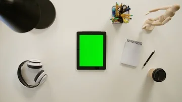 A Finger Touching a Green Screen of the iPad Stock Footage 86091997