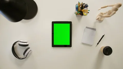 A Finger Touching a Green Screen of the iPad Stock Footage 86092440
