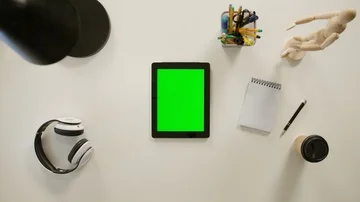 A Finger Touching a Green Screen of the iPad Stock Footage 86092635
