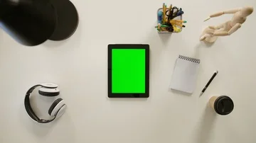 A Finger Touching a Green Screen of the iPad Stock Footage 86093130