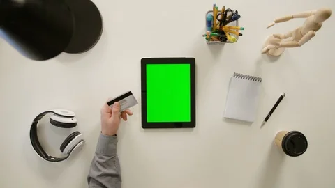 A Finger Touching a Green Screen of the iPad Stock Footage 86097278