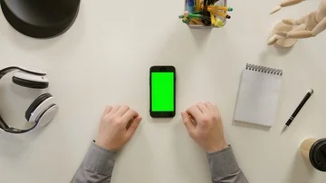A Finger Touching a Green Screen of the Smartphone Stock Footage 86098749
