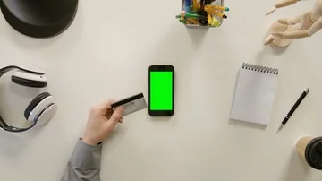 A Finger Touching a Green Screen of the Smartphone Stock Footage 86104199