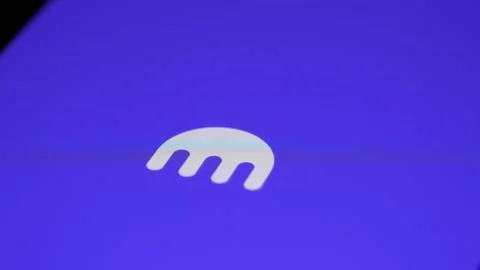 Finger touching Kraken application on smartphone. Selling and buying bitcoins Stock Footage 295348957
