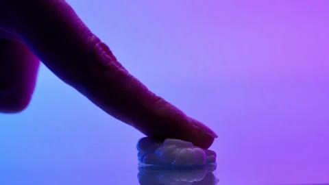 Finger Touching Modern Spoon on Smooth Surface Minimalistic View Stock Footage 312377823