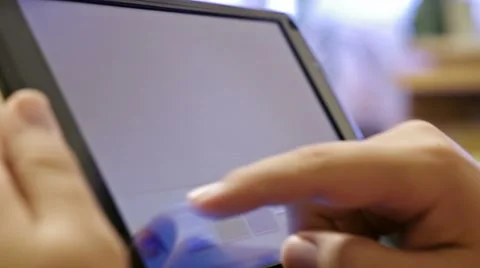 Finger touching screen on tablet pc Stock Footage