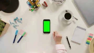 A Finger Touching a Smartphone with a Green Screen Stock Footage 86047517