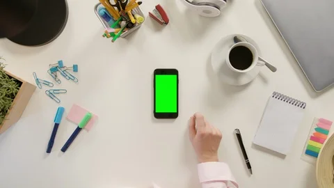 A Finger Touching a Smartphone with a Green Screen Stock Footage 86048525