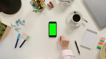 A Finger Touching a Smartphone with a Green Screen Stock Footage 86048662