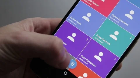 Finger touching a smartphone with a touch screen to unlock and call number Stock Footage 70141064