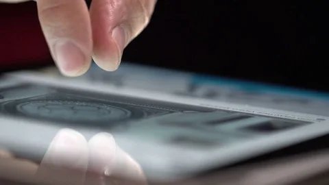 Finger touching tablet Stock Footage 74625925
