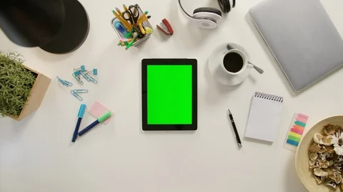A Finger Touching a Tablet with a Green Screen Stock Footage 86037410
