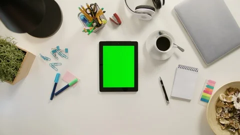 A Finger Touching a Tablet with a Green Screen Stock Footage 86037482