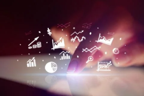 Finger touching tablet with reports and charts above Stock Photos