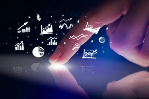 Finger touching tablet with reports and charts above Stock Photos