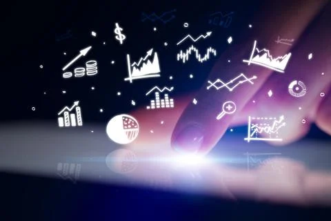 Finger touching tablet with reports and charts above Stock Photos