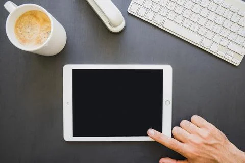 Finger touching tablet s screen work Stock Photos