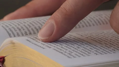 Finger traces the lines in the book Stock Footage 140315203