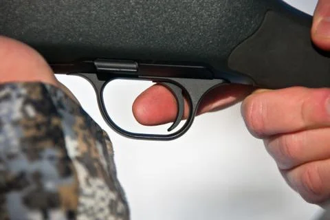 Finger on the trigger. The index finger on the trigger Stock Photos