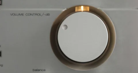Finger is turning up and turning down the volume in a stereo. Stock Footage 108013903