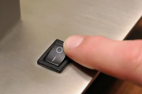 Finger turning switch off for lamp Stock Photos