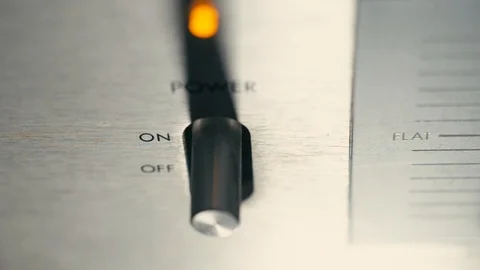 A finger turns on the switch of an electronic device Stock Footage 100391708