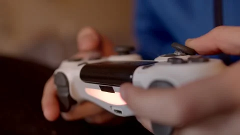 Finger twitches joystick, game simulator The player skillfully uses a controller Stock Footage 295932402