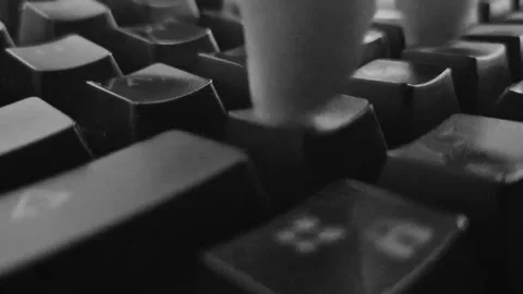 Finger typing on a mechanical keyboard, black and white Stock Footage 338427382