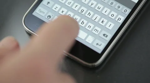 Finger typing message on cellphone Stock Footage 49184860