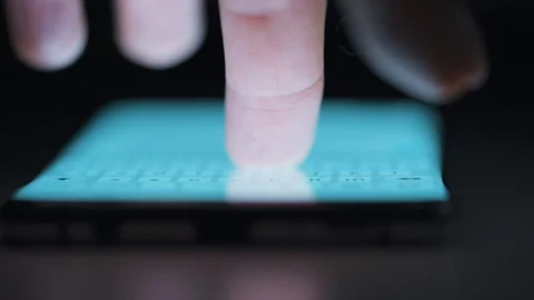 Finger typing text on smartphone close-up. Using smartphone close up at night. Video stock 127516306