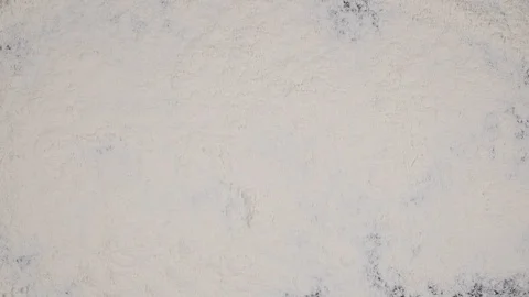 Finger write BAKING on a white flour background. top view 4k Stock Footage 91974445