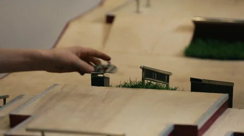 Fingerboard tricks on table Stock Footage 59963051