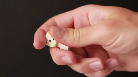 Fingering white dice closeup 動画素材 75827520