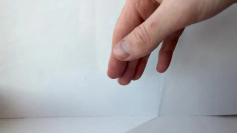 Fingernails tapping on glass surface making sharp rhythmic clicking sound Stock Footage 328704951